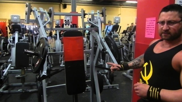 'Standing shoulder press using Hammer incline machine'