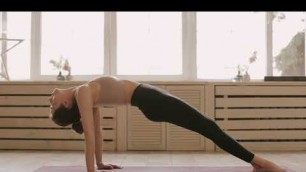 'popsugar fitness video/a-woman-doing-an-upward-plank'